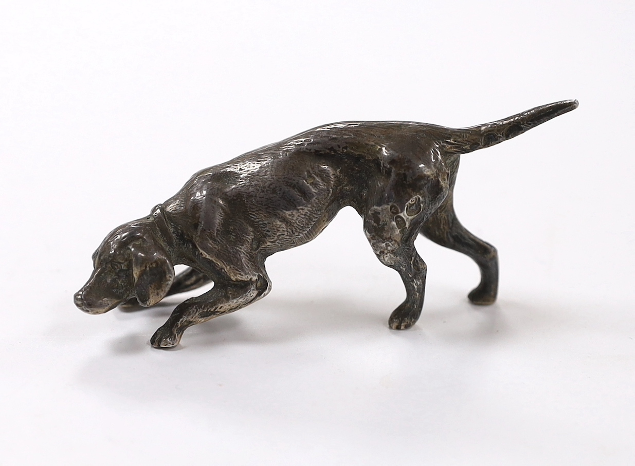 An Edwardian miniature silver model of a dog, import marks for Arthur Graf, Chester, 1905, length 76mm.